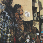 2016: OneinNine paints a mural, I wear my body without shame, with members of India’s Fearless Collective and HOLAA Africa, on the wall of the Florence Building in Hillbrow. (Photograph courtesy of: Judy Seidman/OneinNine)