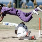 25 September 2019: A batsman from Kwazulu-Natal, in purple, jumps over a player from the Free State, in white, to avoid being run out during the 2019 Blind National Cricket Tournament.