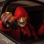 31 October 2018: People in La Casa de Papel costumes pose during a parade to demand quality education and to commemorate Halloween in Bogota, Colombia.